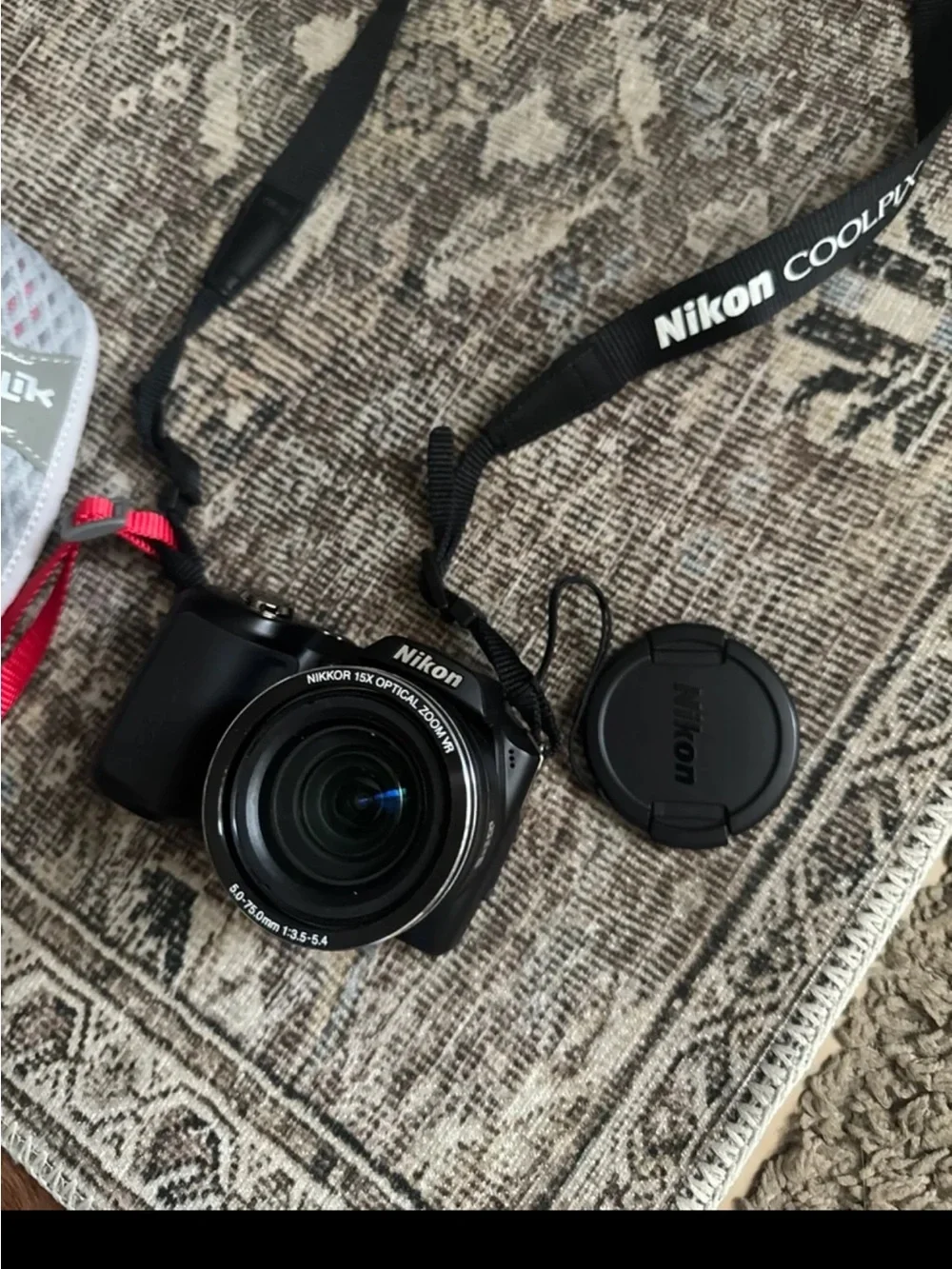 Nixon Black Compact Camera with Detachable Lens Cap and Neck Strap